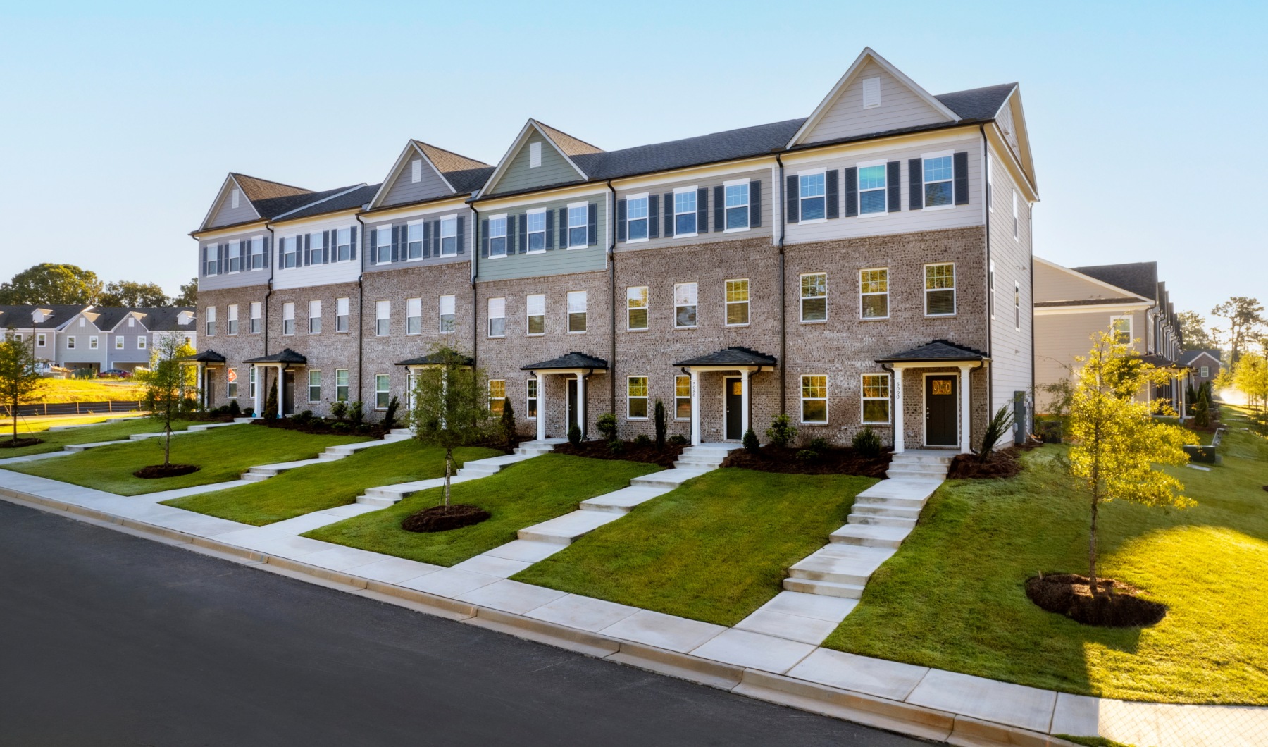 Exterior of townhomes with covered front porches