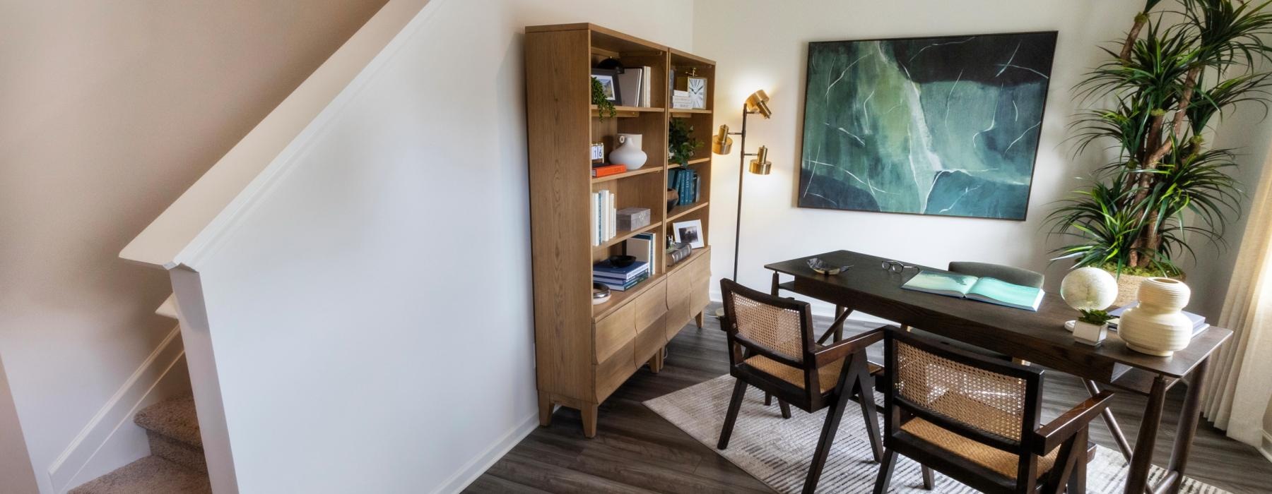 a dining room with a table and chairs