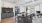 community space with an island and bar stools and a counter with a coffee bar