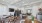 community space with a kitchen area in the background and a